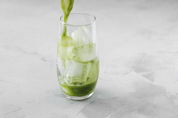 Pouring matcha over ice