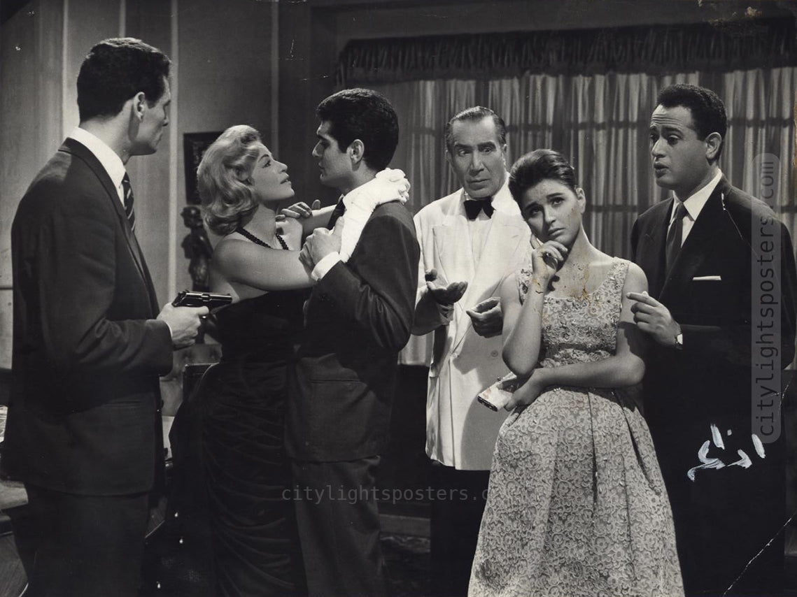Abdelmoneim Ibrahim (to the right) in the best friend role in Love Rumor (1960). The film stars Omar Sherif and Soad Hosny, in addition to Youssef Wahbi and Hind Rostom.