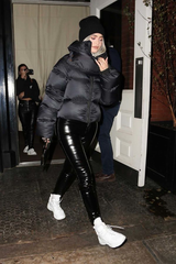 Kylie Jenner wearing a black puffer jacket in 2022