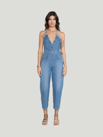 Model wearing a denim halter long jumpsuit