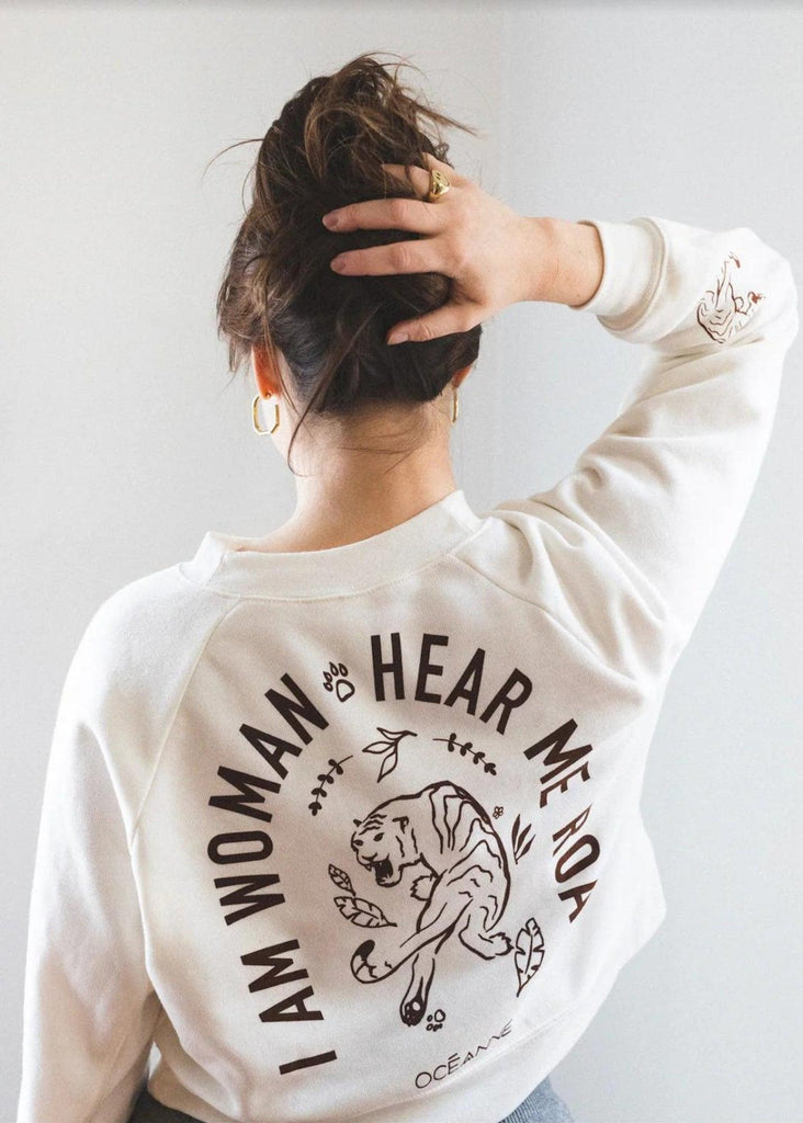 Model wearing I am Woman Hear Me Roar sweater from Oceanne