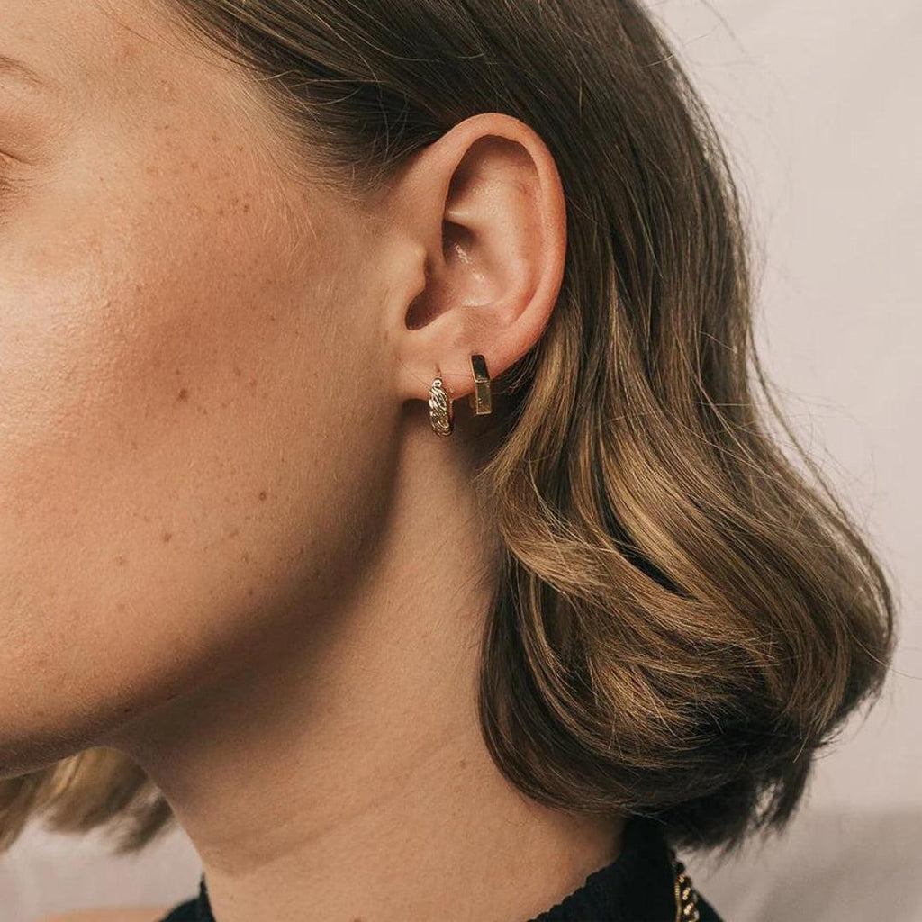 Model wearing earrings from Mod and Jo
