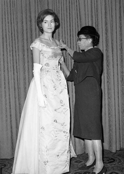 African American fashion designer Ann Lowe fixes her dress design on model African American fashion icons Black History Month boutiques in Minneapolis