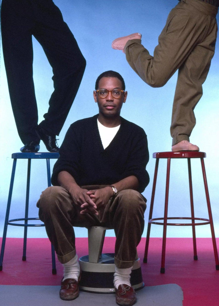 African American fashion designer Willi Smith posing with two people on stools African American fashion icons Black History Month boutiques in Minneapolis