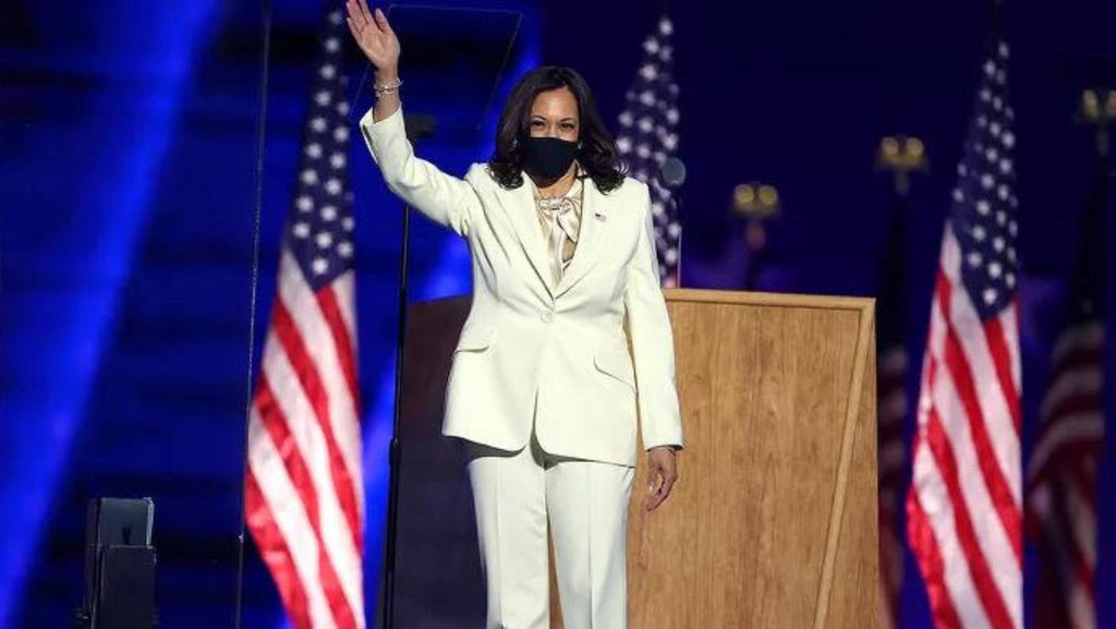 Kamala Harris wearing a white pantsuit