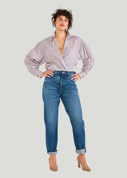 Model is wearing Etica Denim Bryce Pinch Boyfriend Jeans with button-up shirt