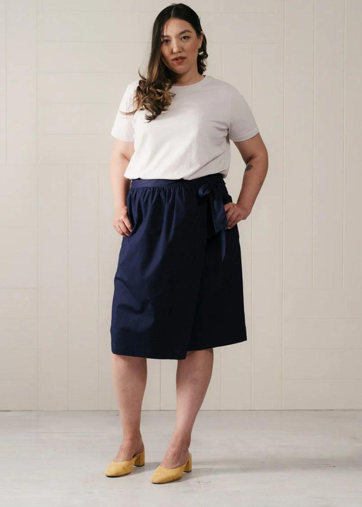 Model wearing And Comfort navy skirt