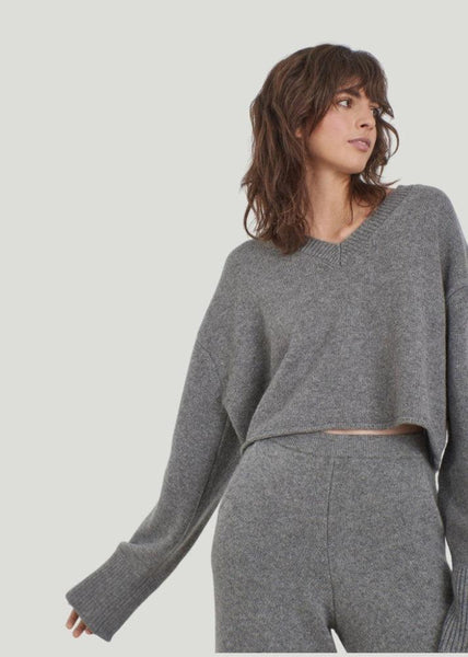 Model is wearing Leap Concept Cashmere Crop Sweater with gray cashmere pants