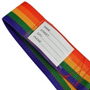 A partial shot of a rainbow strap with a name tag sewn into it.