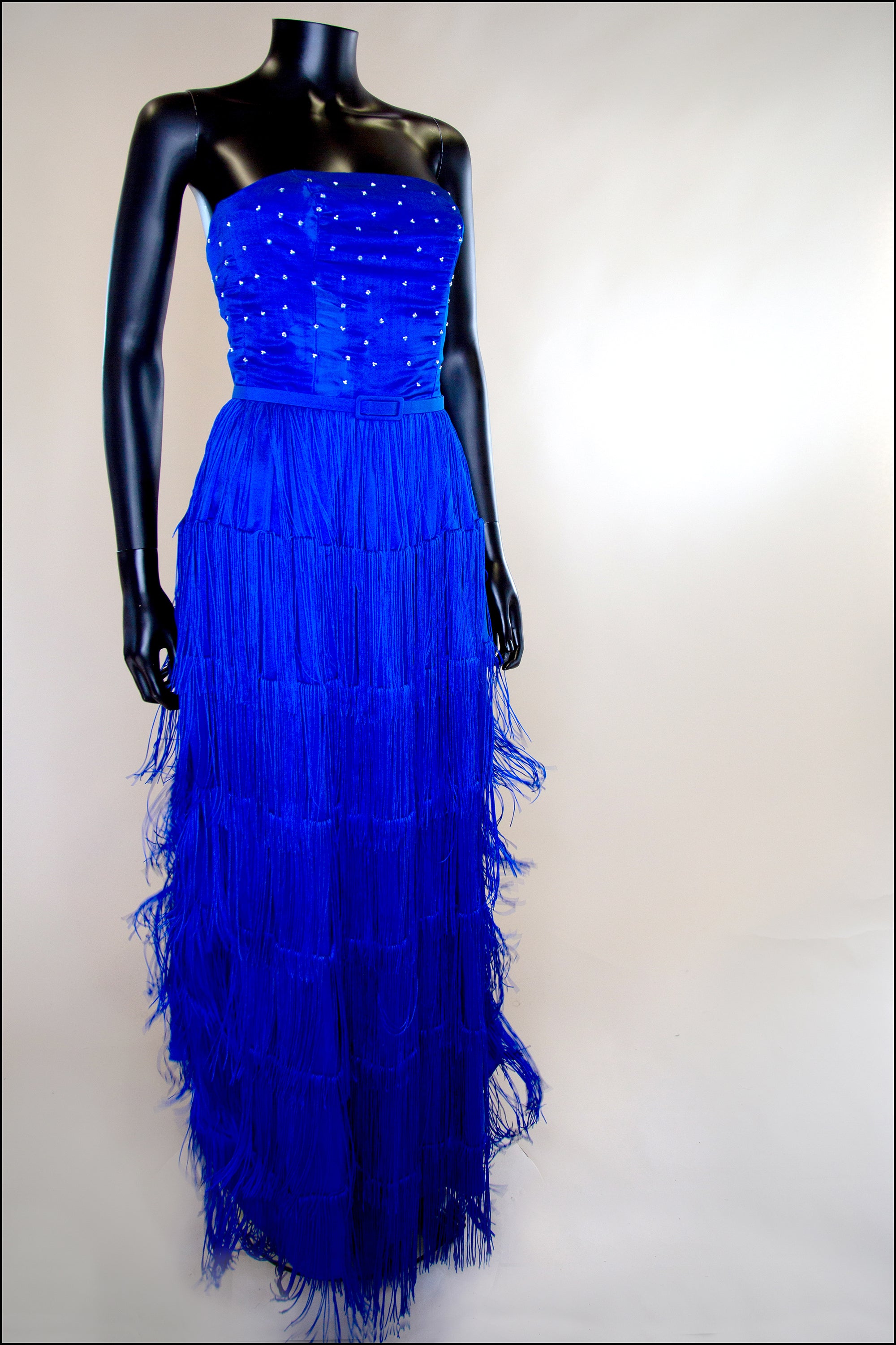 blue tasselled gown by alexandra king 