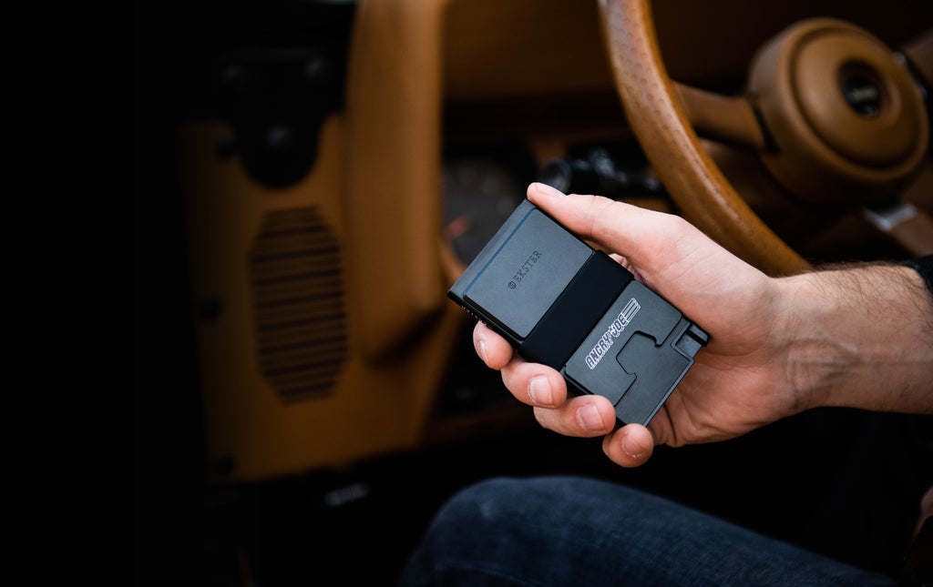 man holding Ekster front pocket wallet