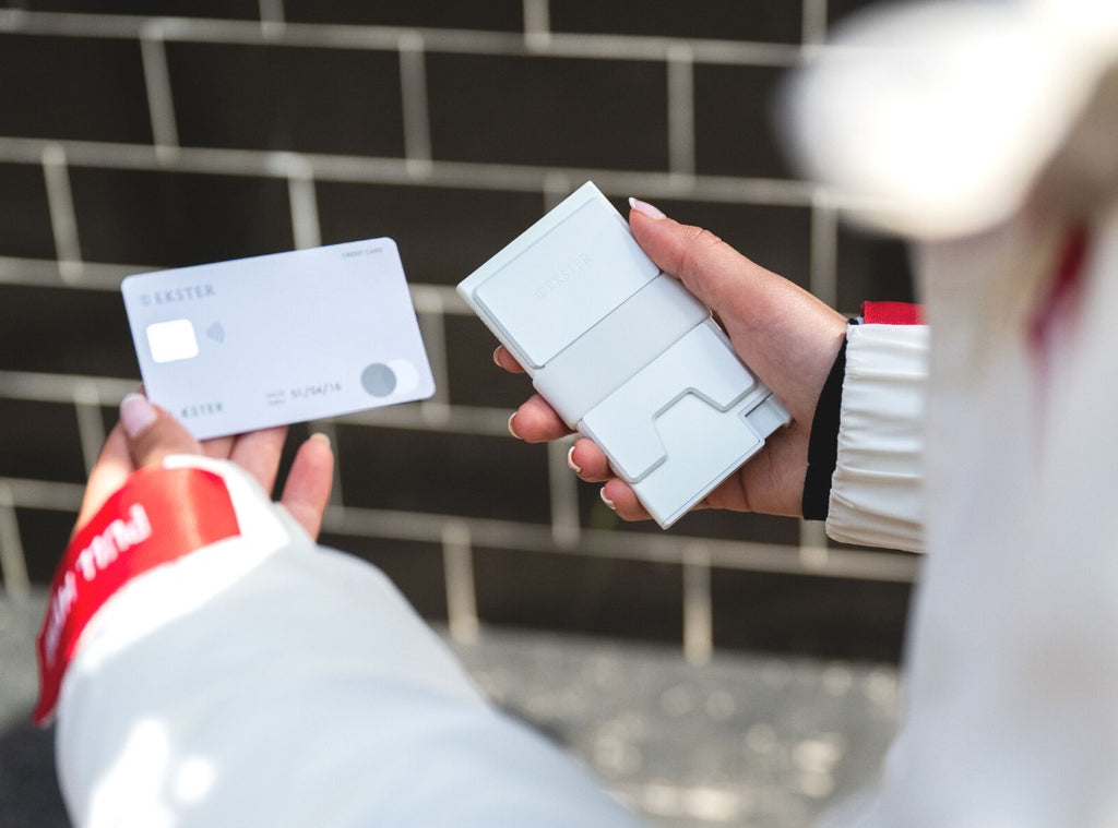 woman holding glow in the dark wallet during the day