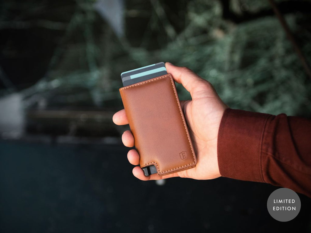person holding limited edition Ekster wallet
