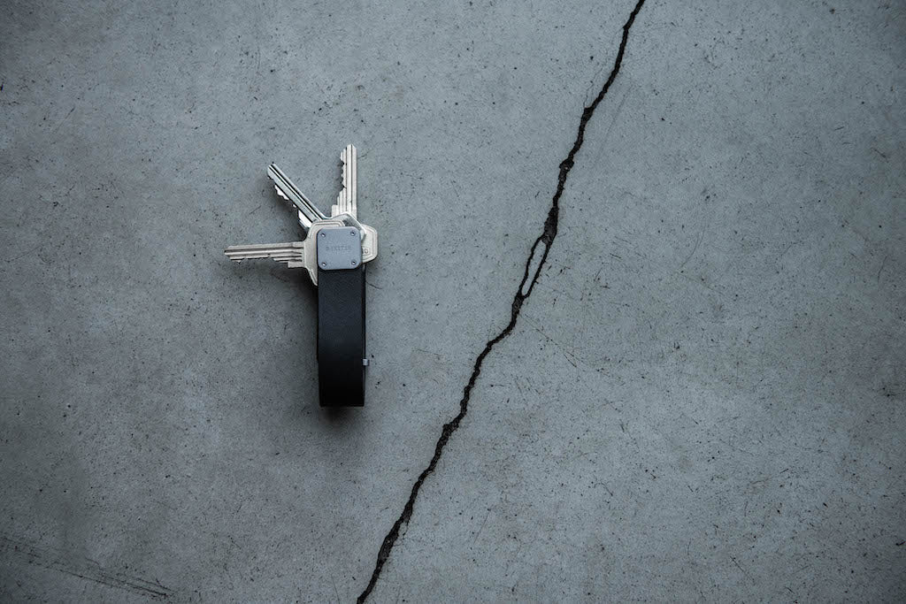 trackable key fob on grey industrial background