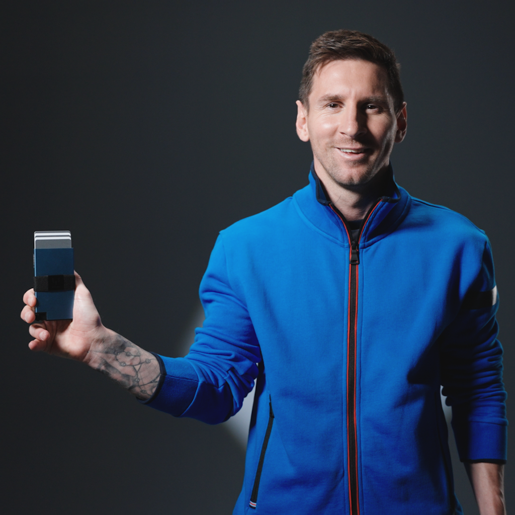 Lionel Messi holding the Messi Wallet by Ekster. 