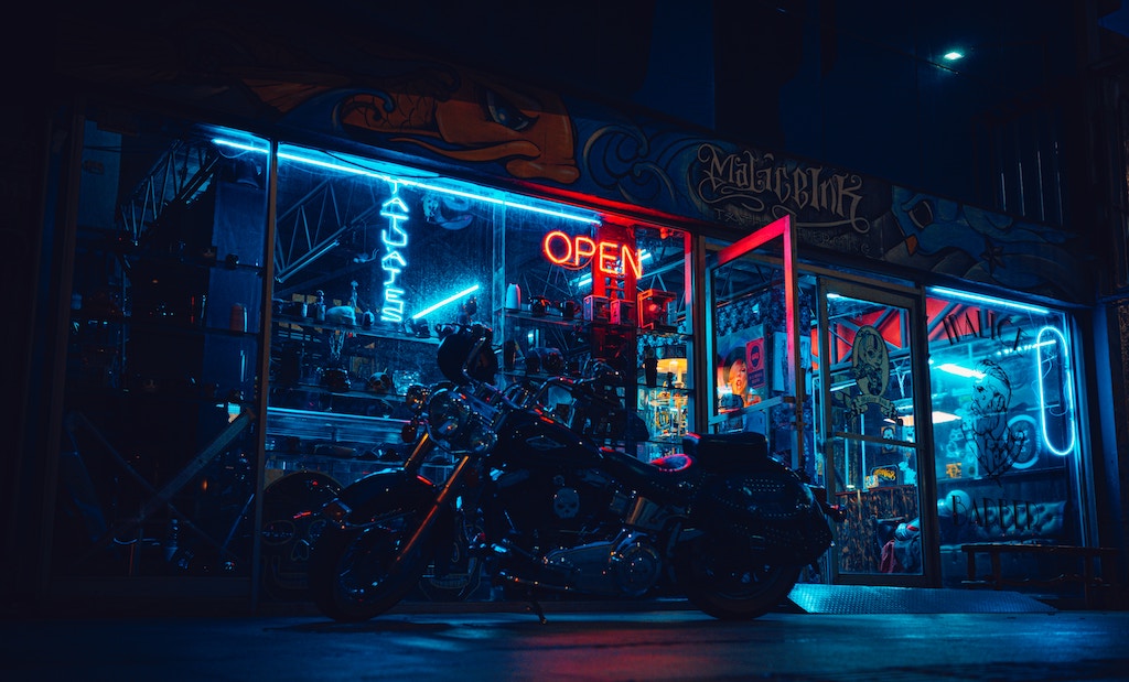 neon city scape with motorcycle