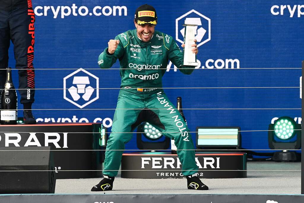 Fernando Alonso holding a trophy