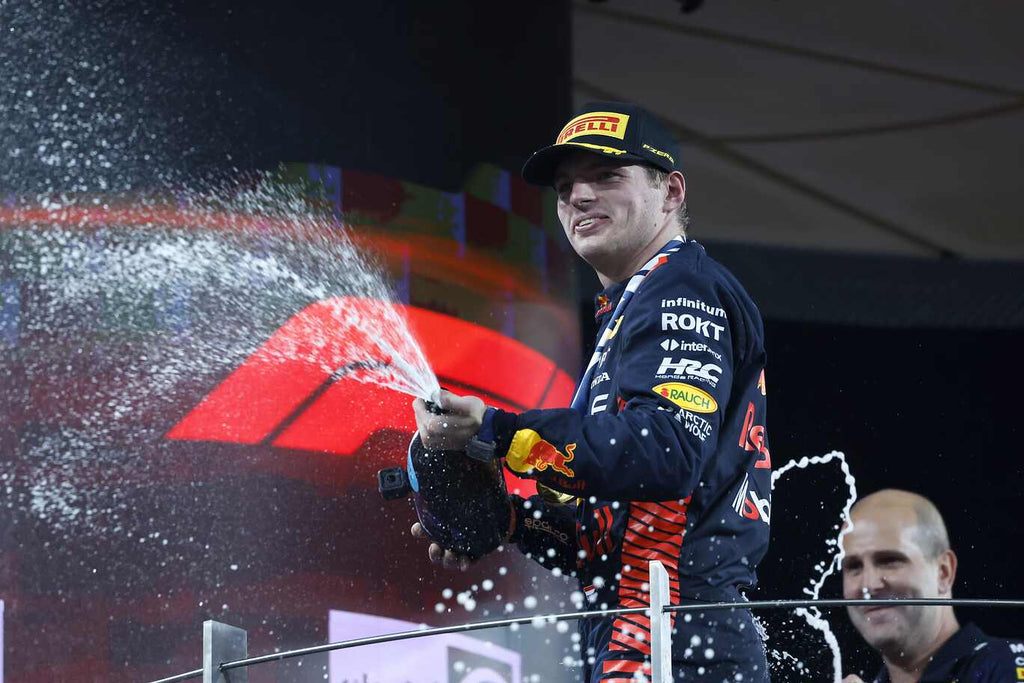 Max Verstappen sprays Champagne on the podium