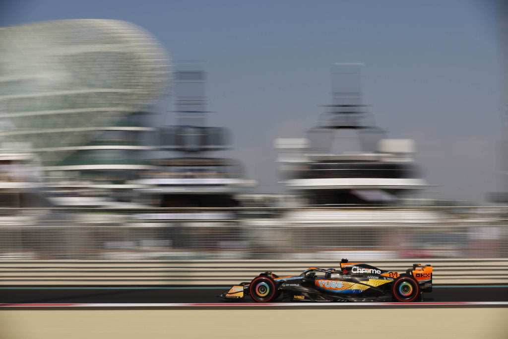 McLaren MCL60 racing on a track