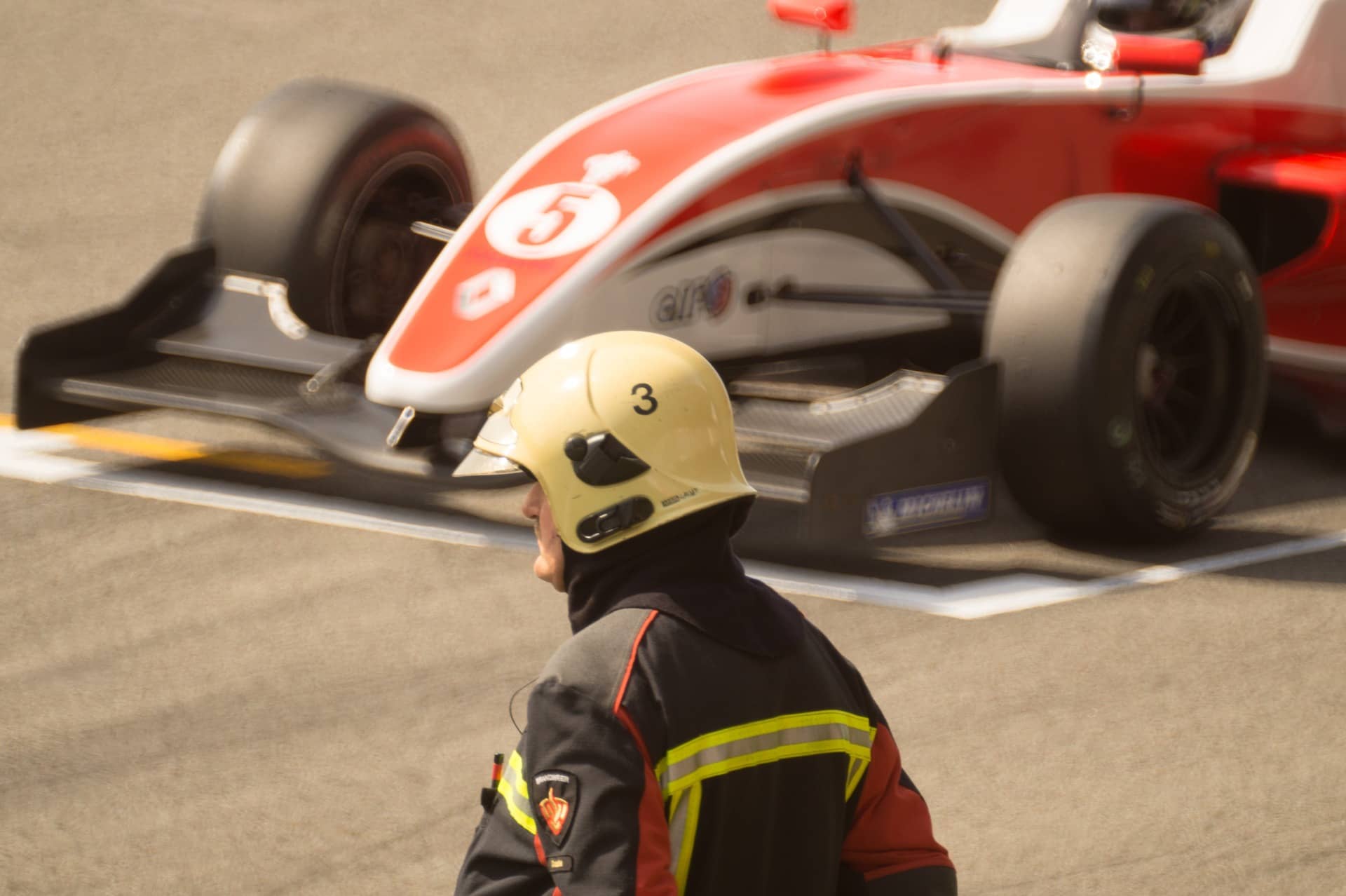 race car with fireman in front