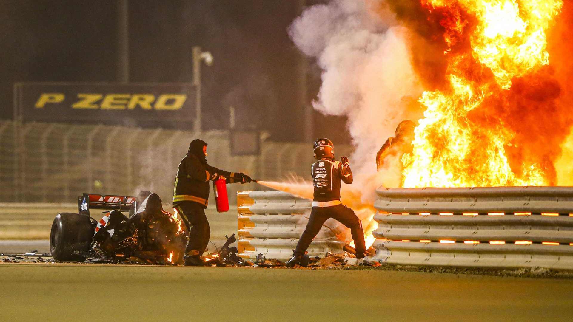 romain grosjean getting out of his car that is on fire at bahrain gp 2020