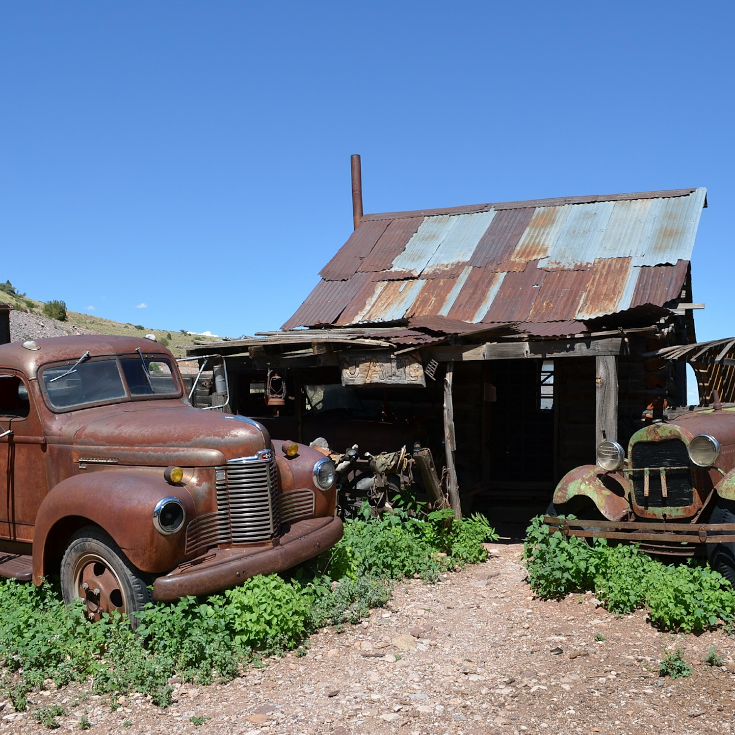 jerome city with rusty old cars in arizona usa