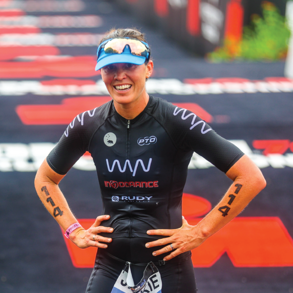 Jackie Hering crossing the finish line at 70.3 World Championships. Photo by Jordan Bryden.