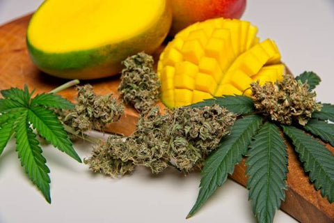 marijuana next to a pineapple