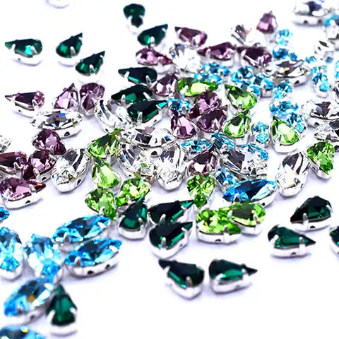 Crystal stones in settings are perfect for embellishment of costume, dress and fabric