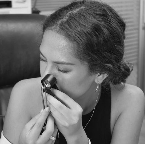 Miss Guerchouche carefully selecting the gems that'll adorn her creations