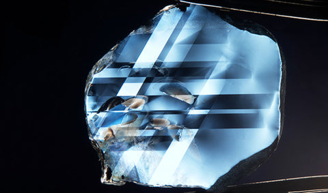 An example of a sapphire cut into a flat wafer and seen through a crossed polarized filter. Photo by Victoria for © GIA Gem and Gemology Summer 2017