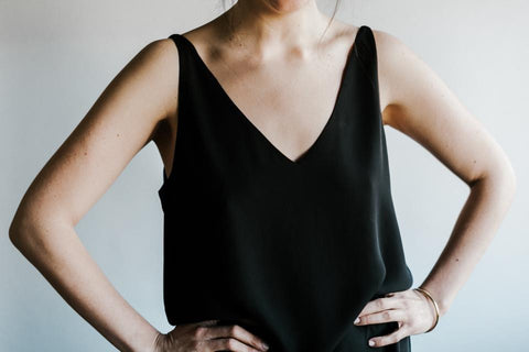 Woman wearing black v-neck top