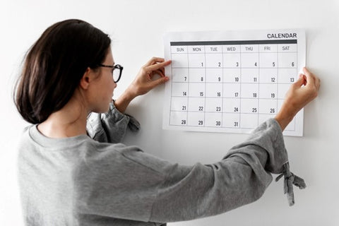 girl-holding-calendar-for-schedule