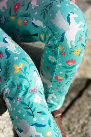 close up of organic cotton frugi leggings with a unicorn print