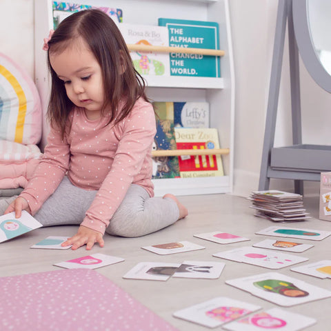 girls playing with Roa and Bo tops and tails matching game