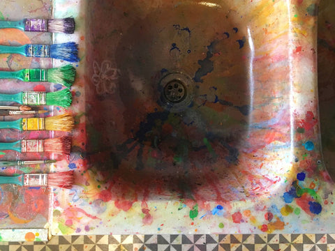 sink splattered with colourful paint