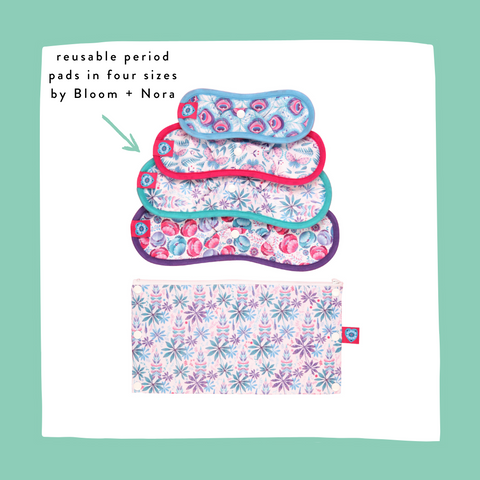 set of reusable period pads by bloom and nora with a floral storage bag