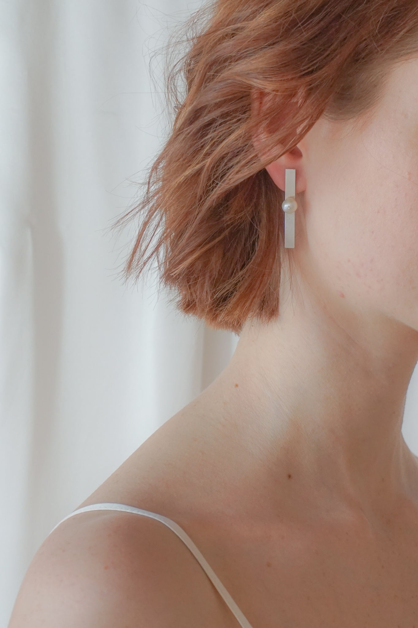 flat linear pearl earrings