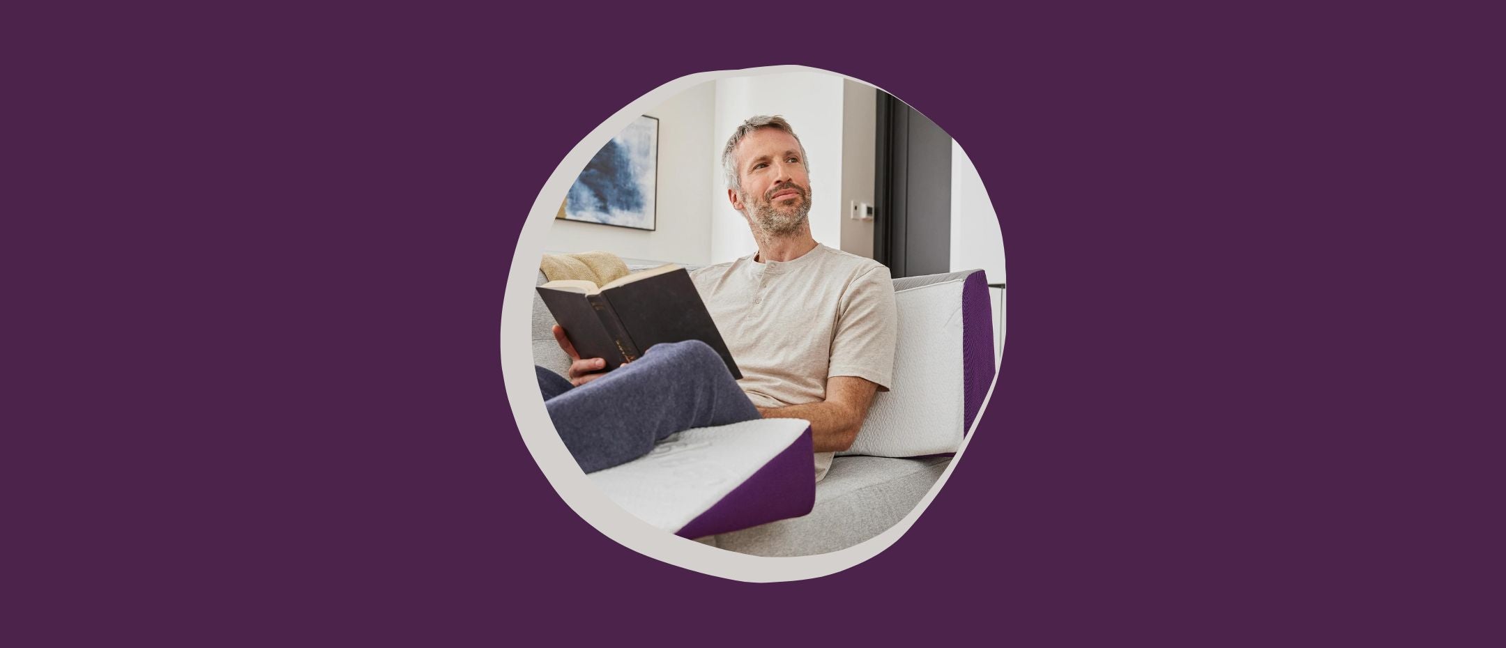 man with a book and lying on the Polysleep orthopedic pillow