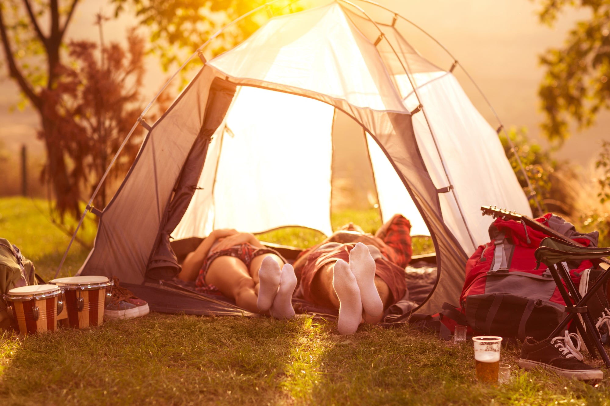 Two people lying in a tent during a heat wave