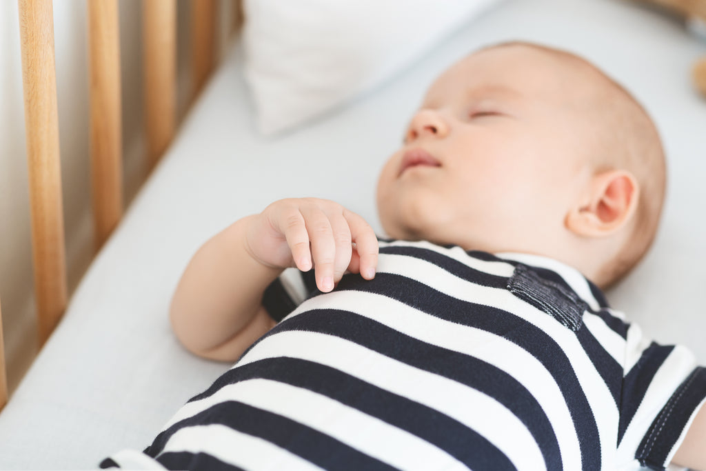 Baby sound asleep on a non-toxic mattress