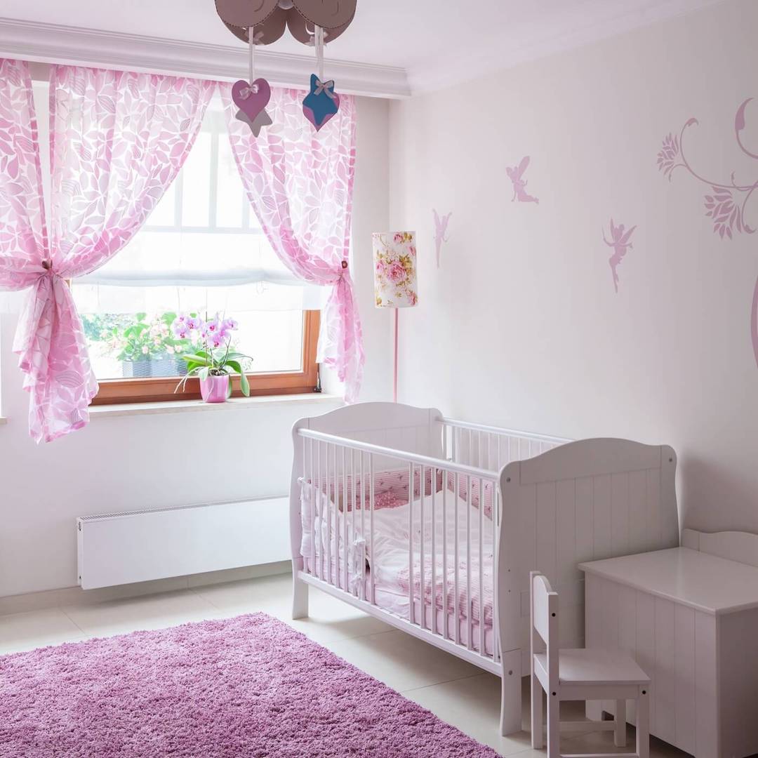 baby room with safe sleeping space and crib without stuffed animals