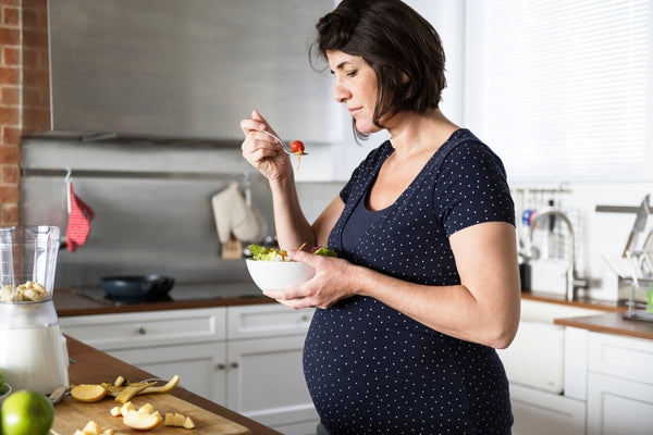 Pregnant woman eating healthy food