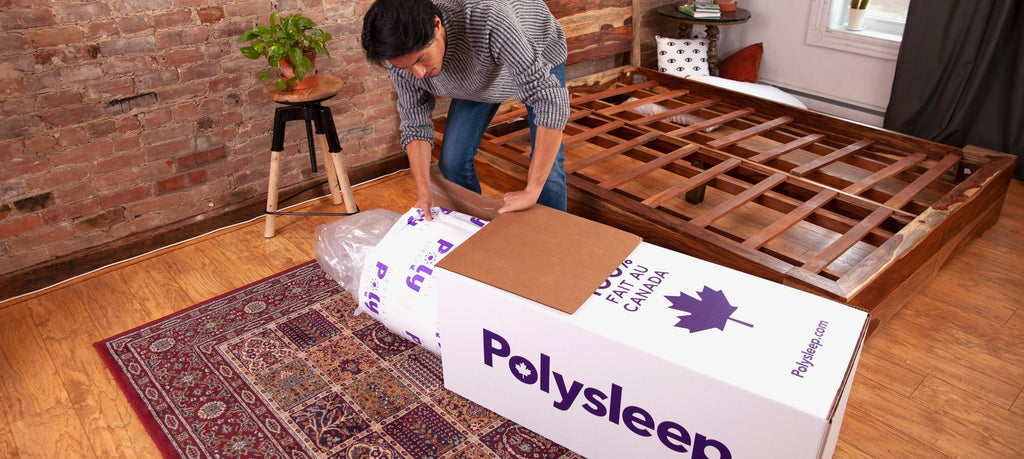 A compressed Polysleep mattress being taken out of its box