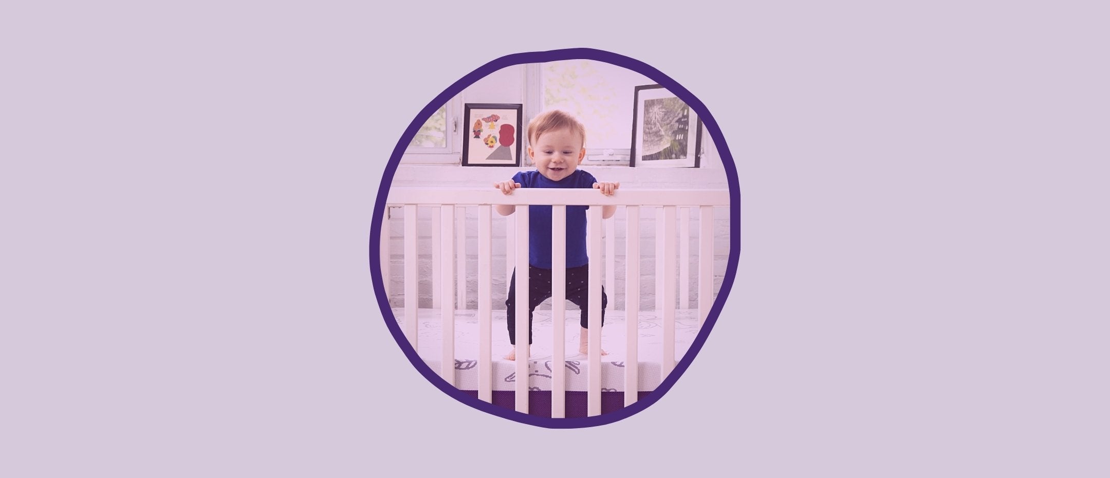 Baby standing on the Polysleep baby mattress