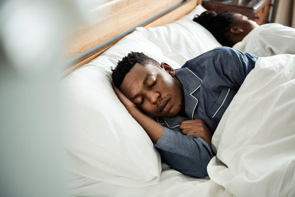 Man sound asleep on his Polysleep Mattress