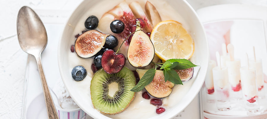 Nice looking breakfast bowl with oranges, kiwis and other fruits.