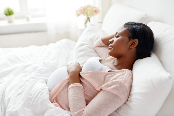 Pregnant woman sleeping with her back elevated