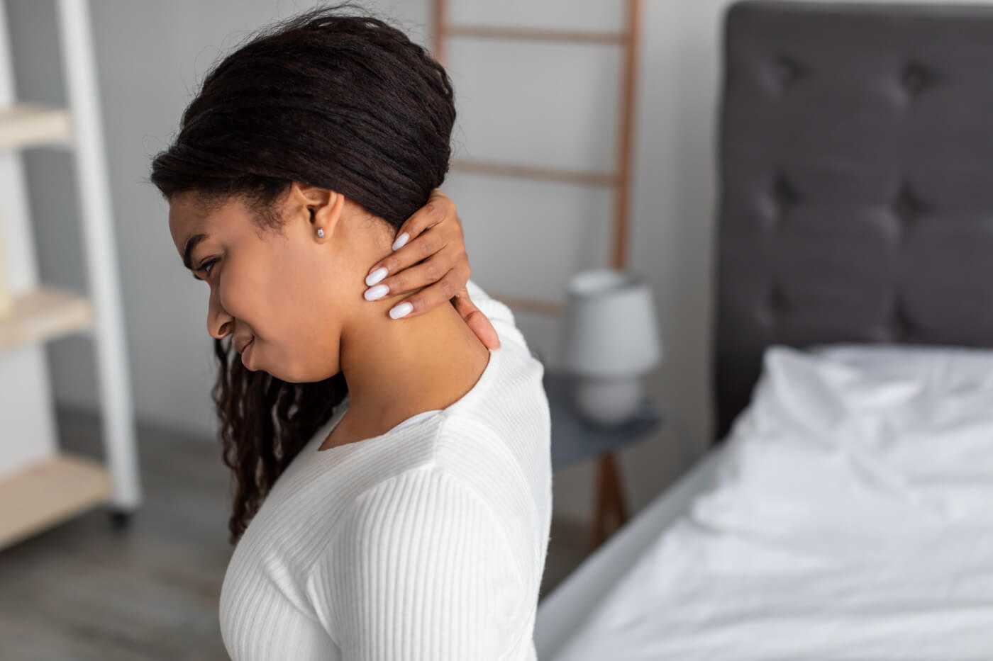 woman with neck intercostal pain sitting in bed