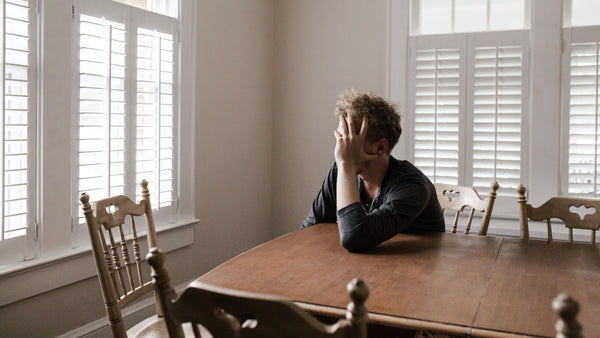 Exhausted man who hasn't been diagnosed with sleep apnea yet